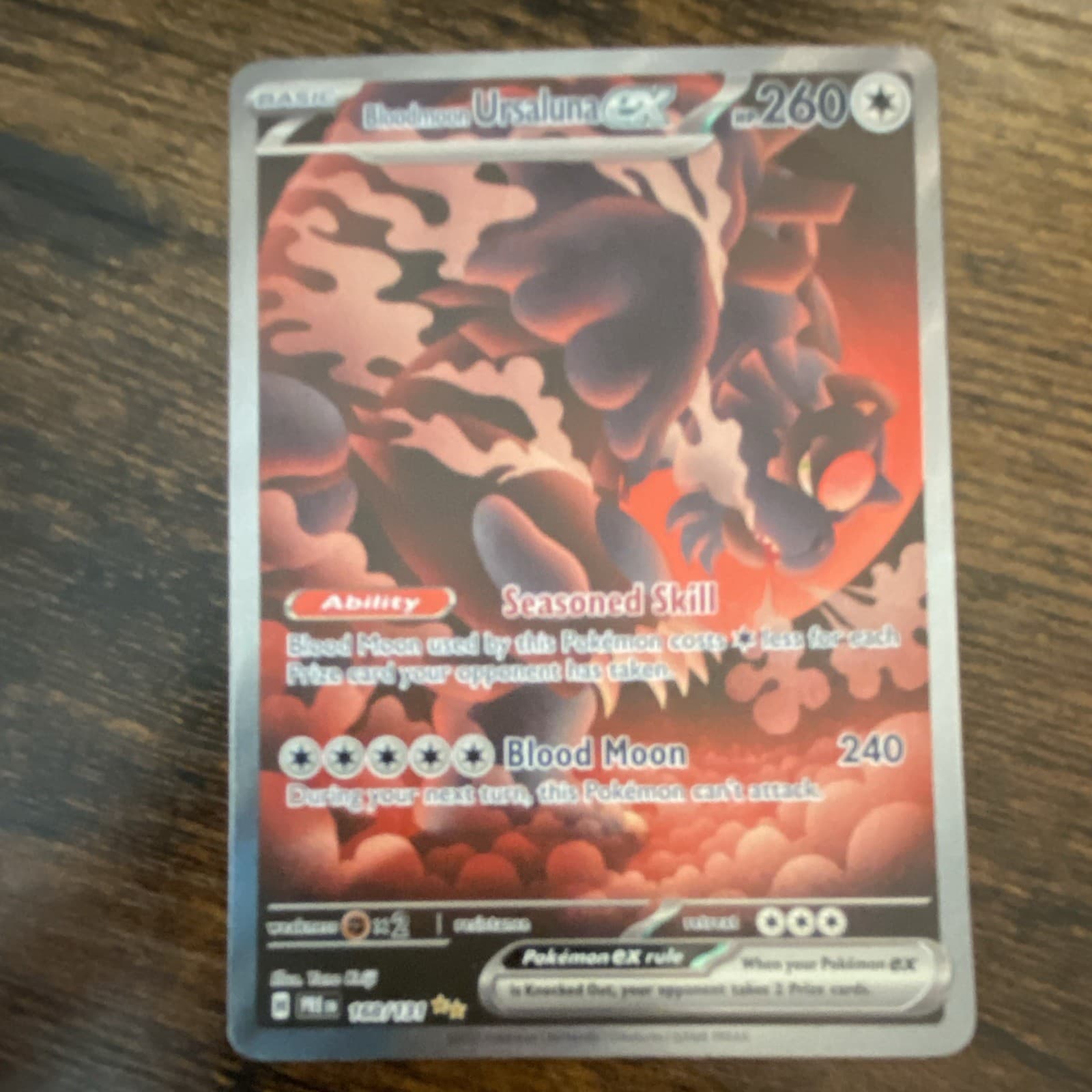 Bloodmoon Ursaluna ex 168/131 Sv: Prismatic Evolutions Holo